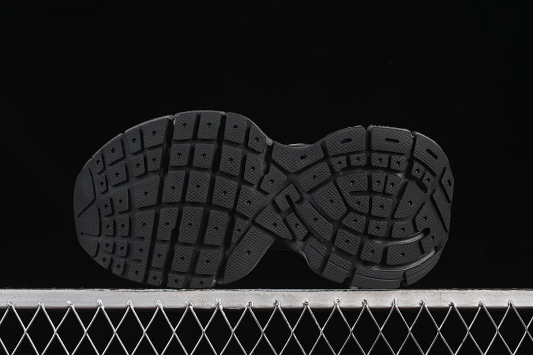Underside view showing the segmented tread pattern.