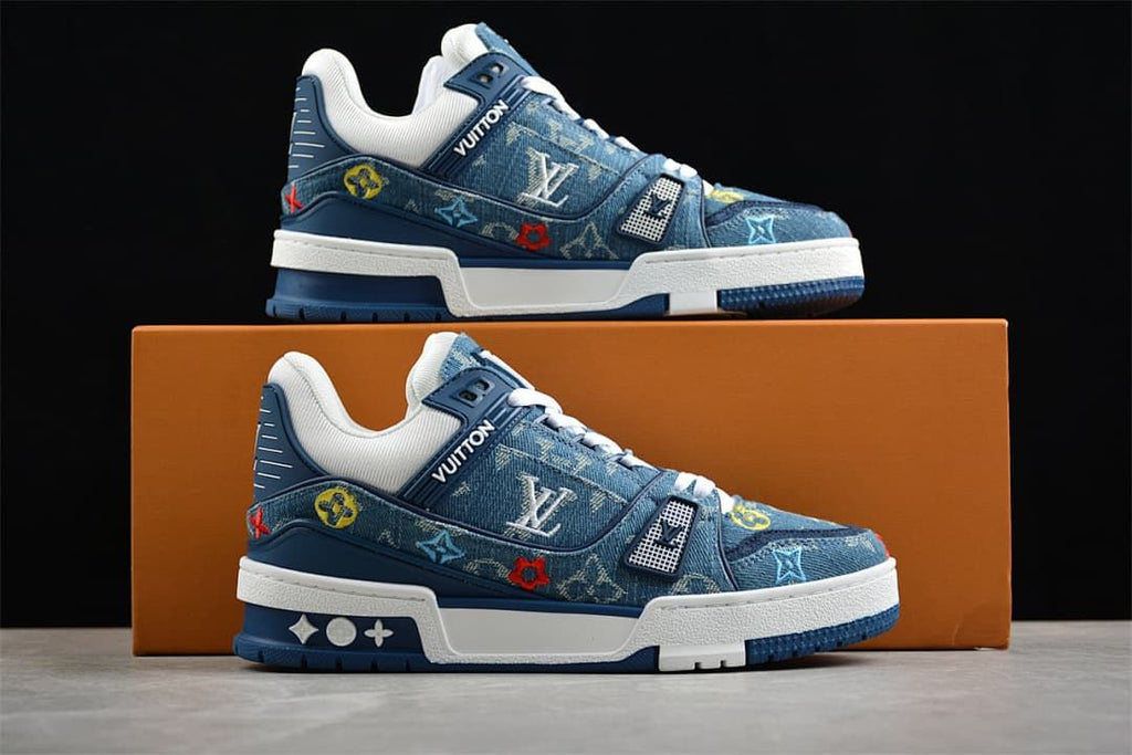 Two side views of the blue patterned sneakers against a box.