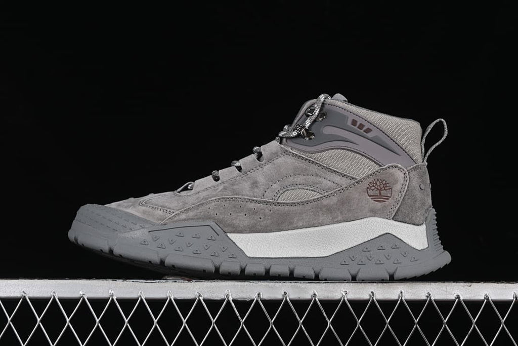 Side view of the gray Timberland mid-top shoe