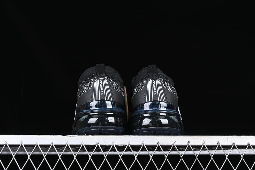 Rear view of the pair showing Vapormax heel panels