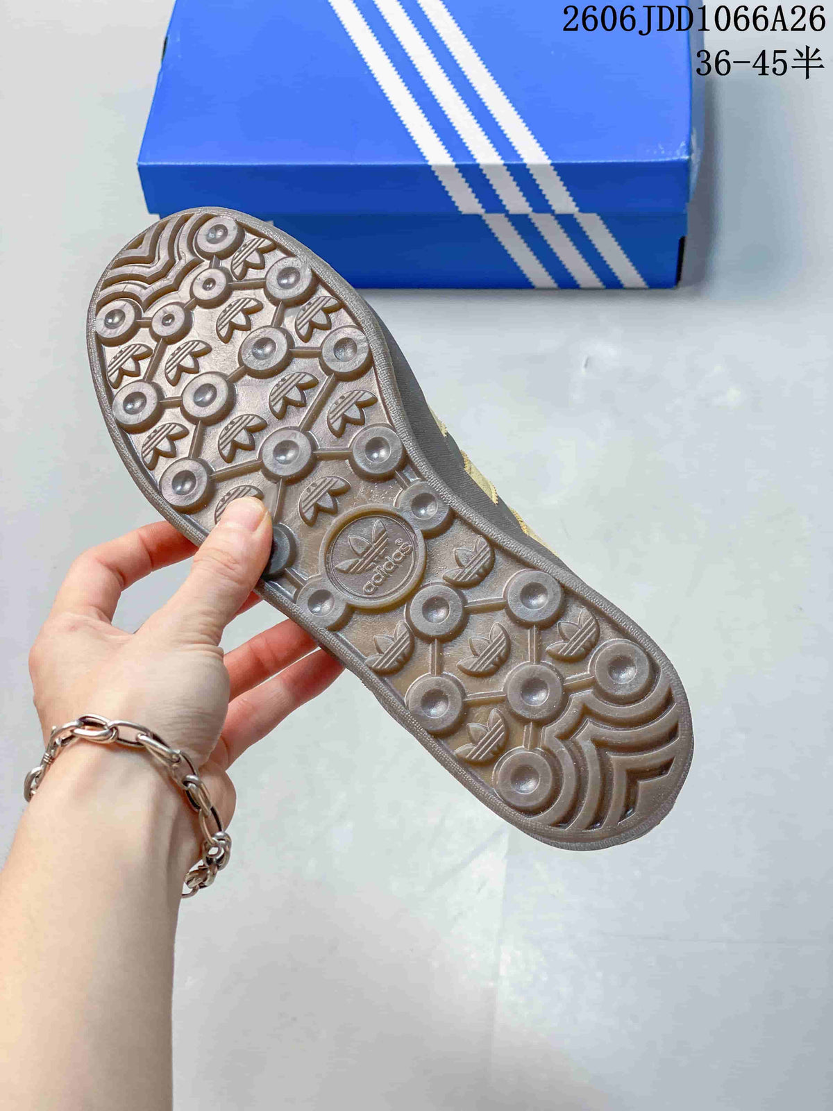 Close-up of the patterned outsole on a grey sneaker