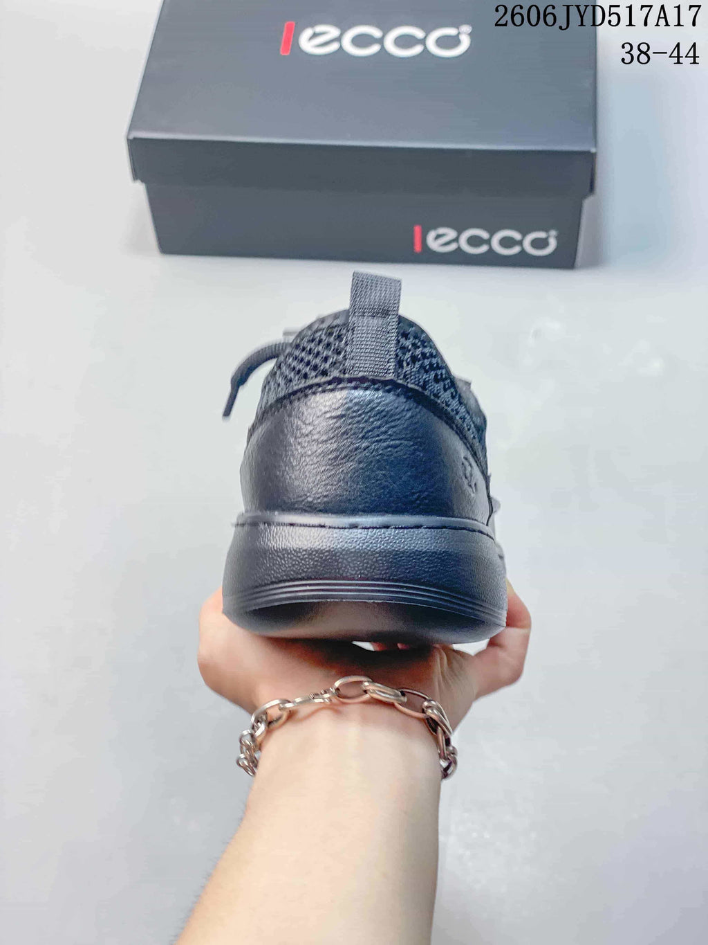 Rear view of a dark gray ECCO sneaker showing the heel and pull tab; image text states sizes 38–44.