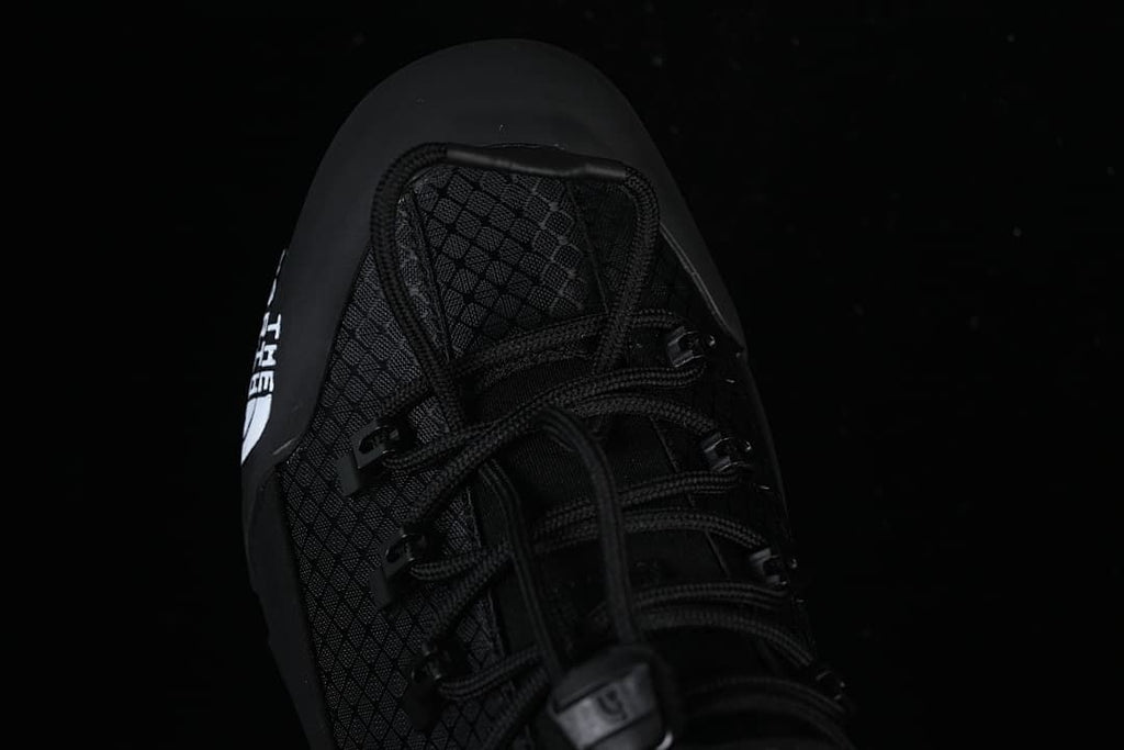 Top-down close-up of the shoe's lacing and toe area.