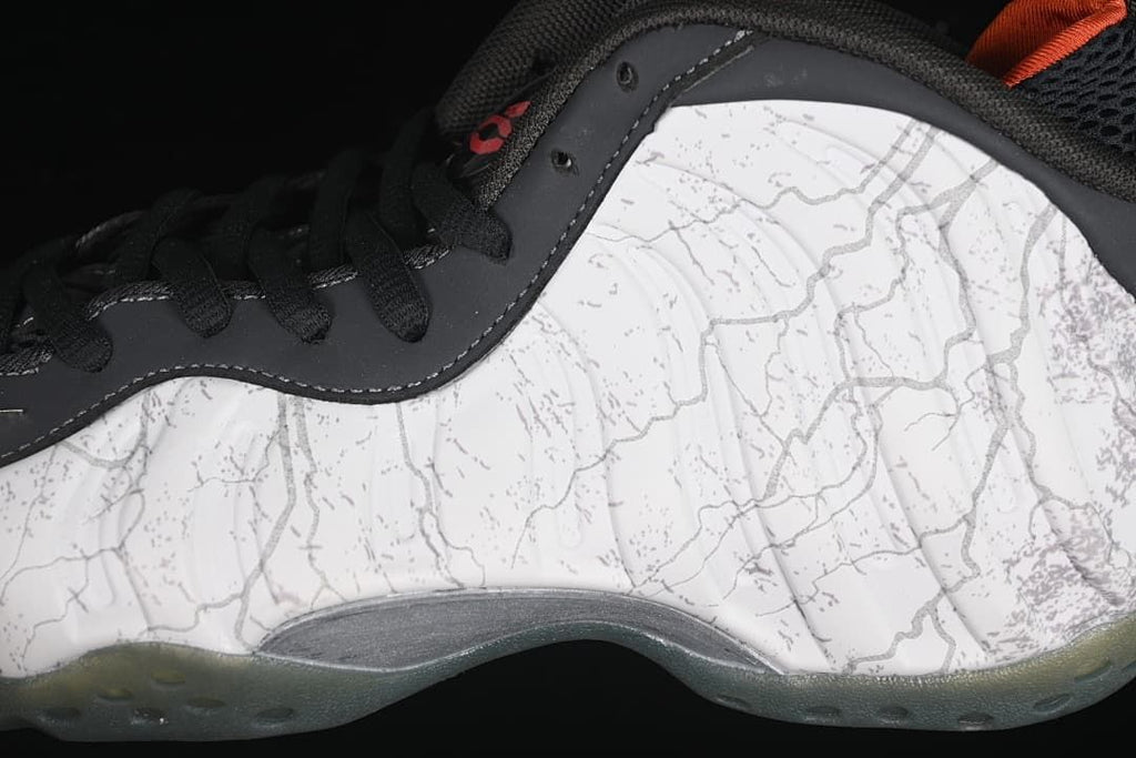 Close-up of the patterned upper, black trim, and translucent outsole.