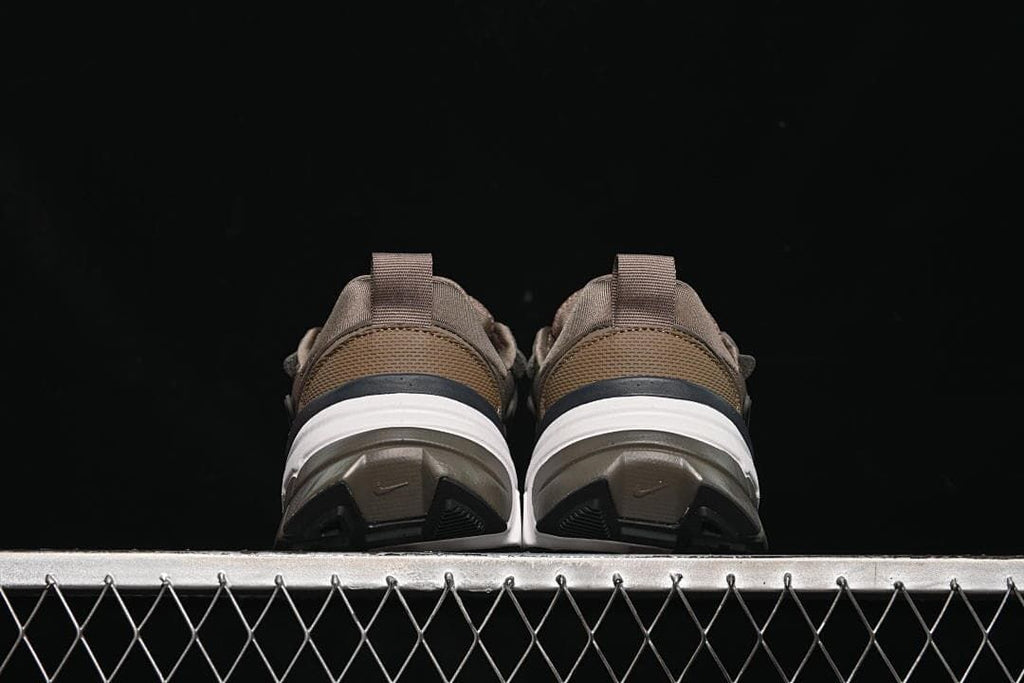 Rear view of both sneakers showing heel and outsole details