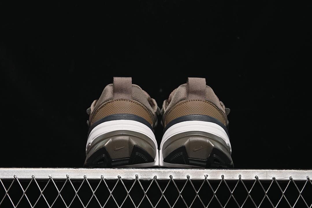 Rear view of both sneakers showing heel and outsole details