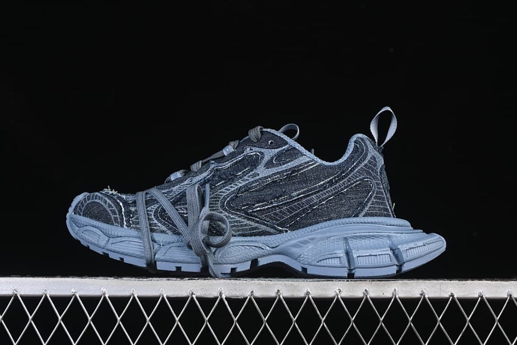 Side view of blue denim-look chunky sneakers with a sculpted outsole