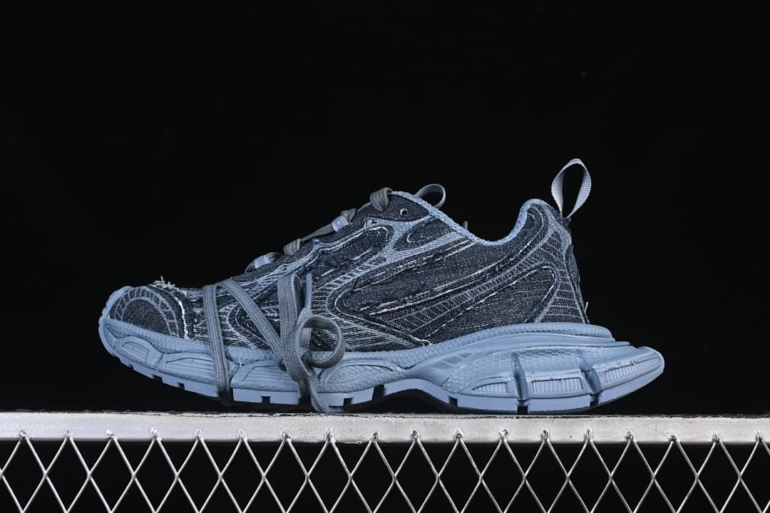 Side view of blue denim-look chunky sneakers with a sculpted outsole