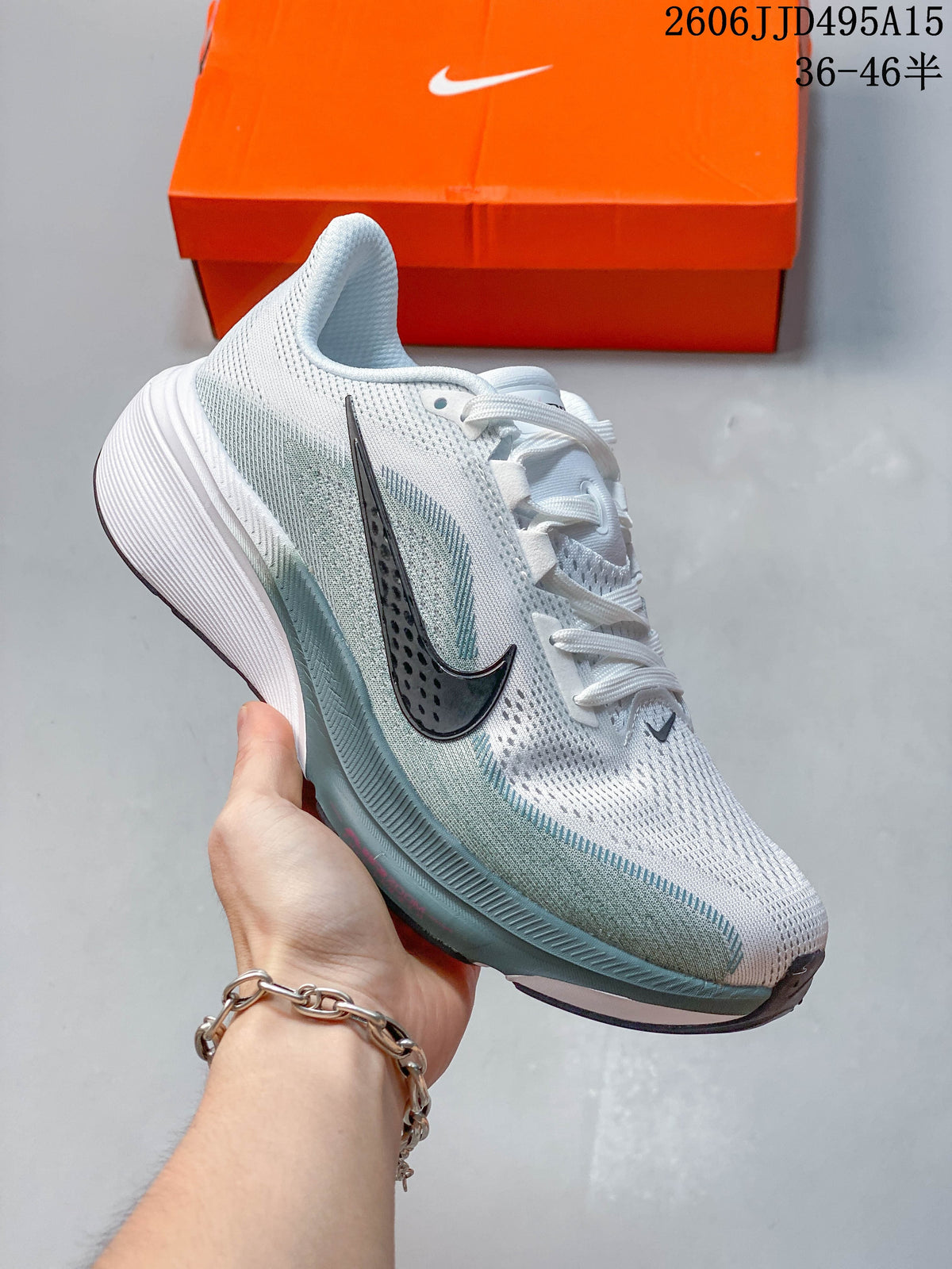 Side view of a white and pale gray-green Nike Pegasus 42 running shoe with dark Swoosh