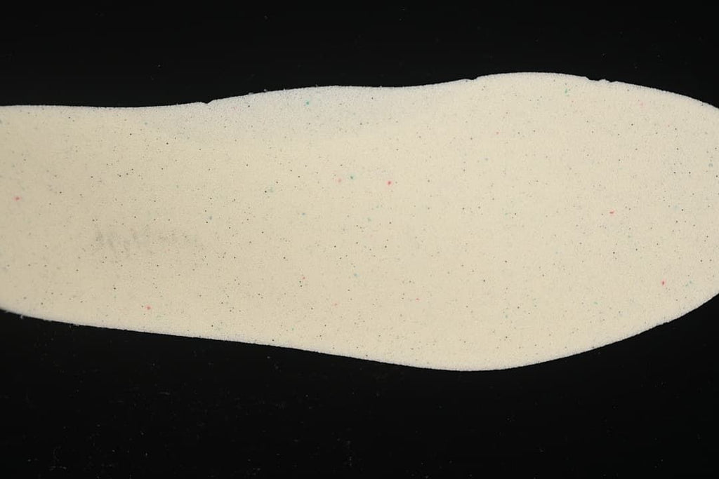 Close-up view of a light-colored shoe insole.