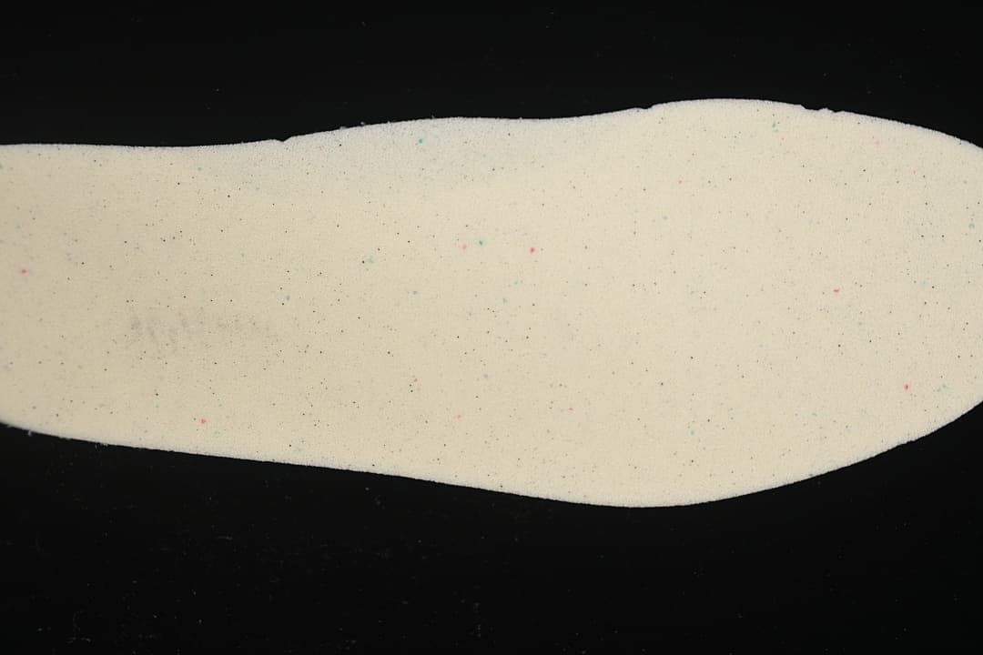 Close-up view of a light-colored shoe insole.