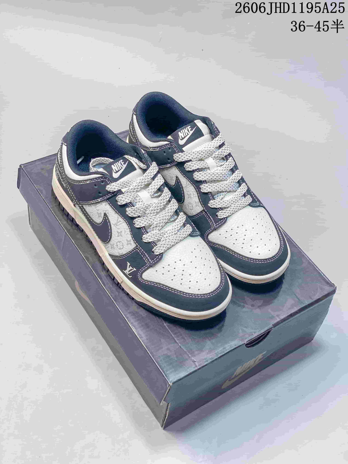Pair of white and navy low-top sneakers with contrasting laces