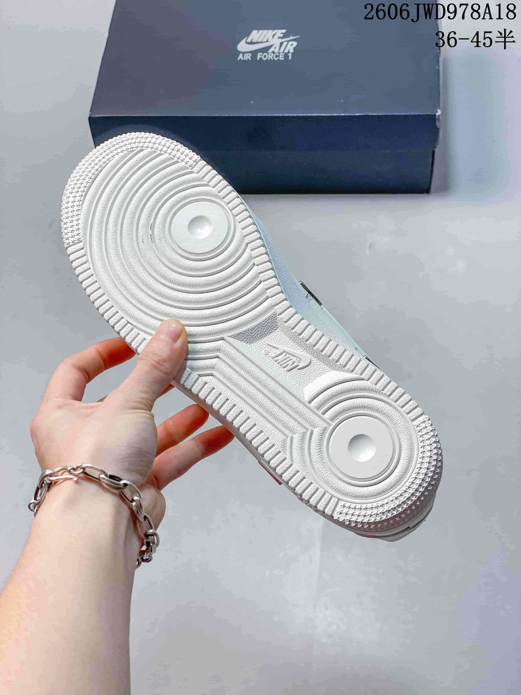 Outsole view of a white Nike Air Force 1 sneaker