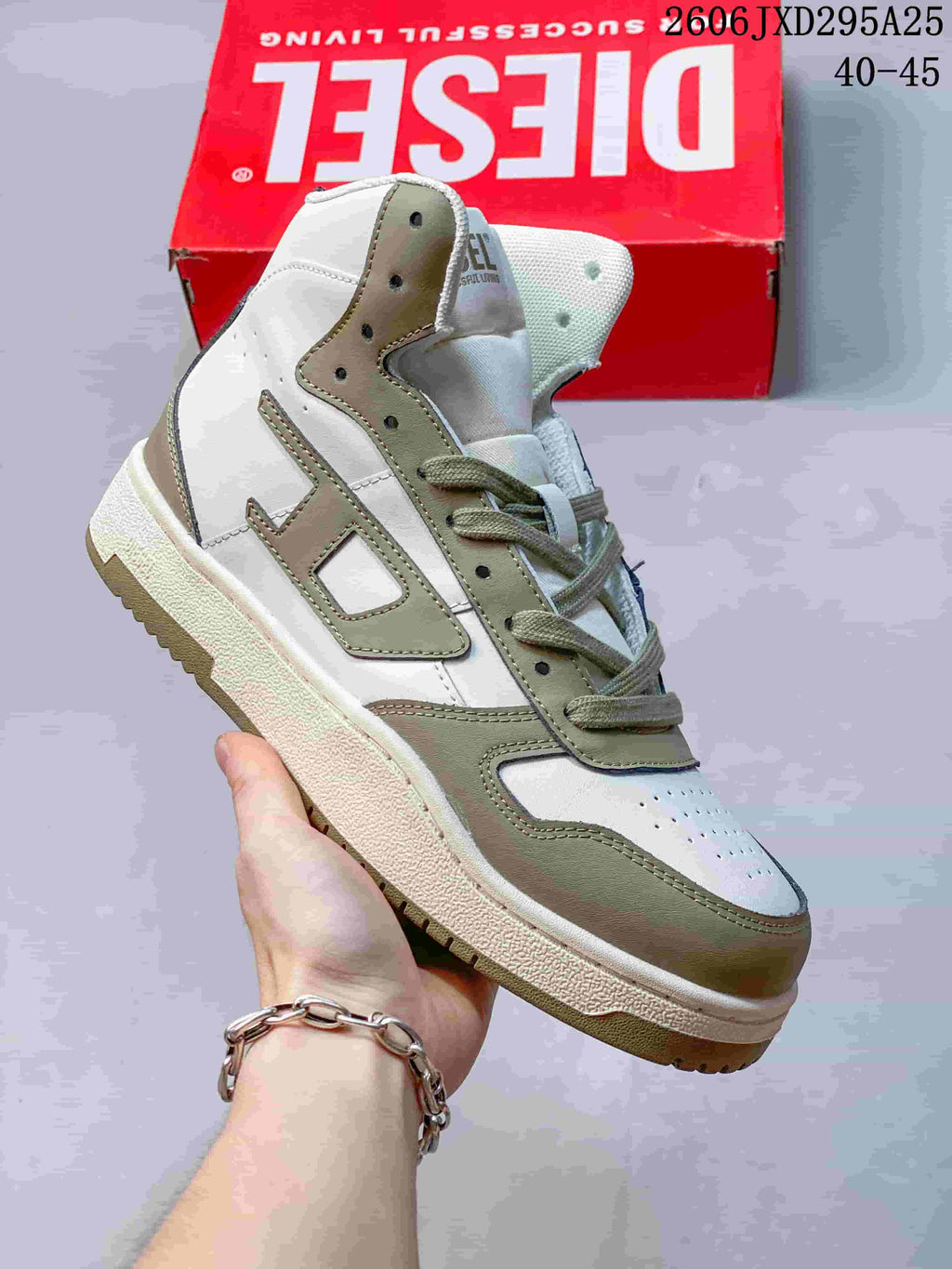 White Diesel S-Ukiyo high-top sneaker with muted green accents, shown at an angle.