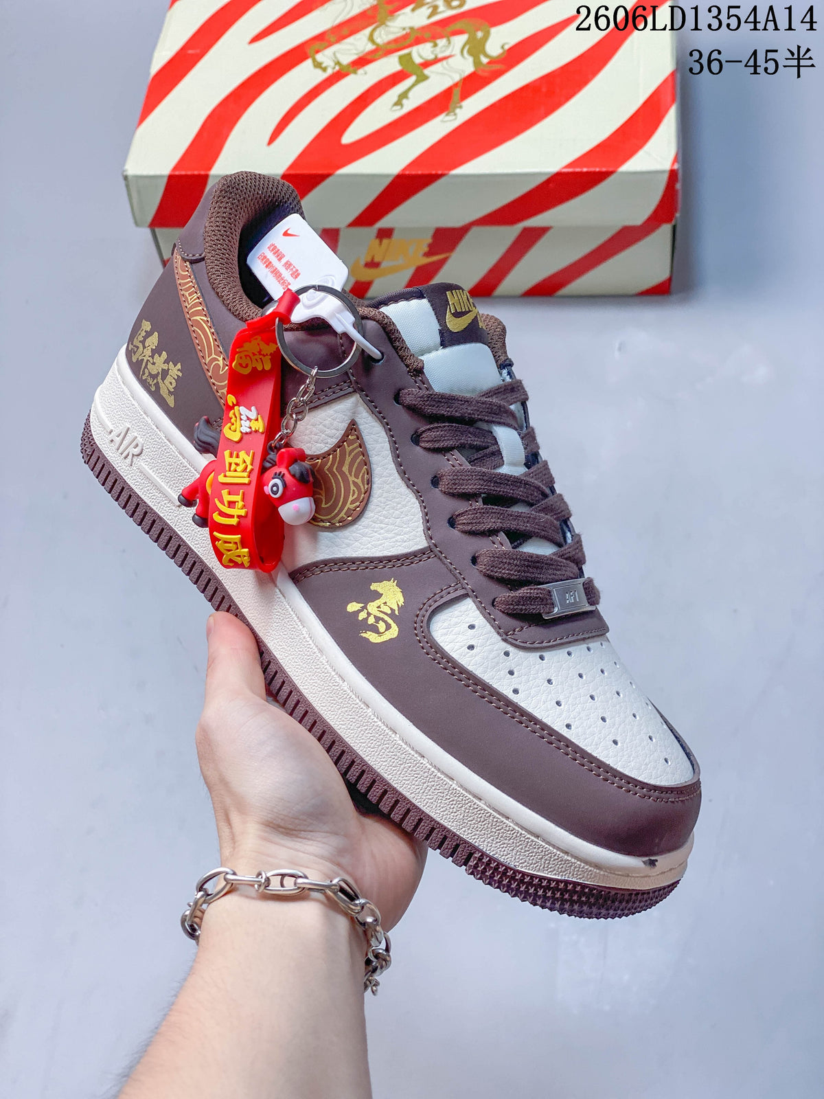 Angled view of a brown and white low-top sneaker with decorative hanging accessories