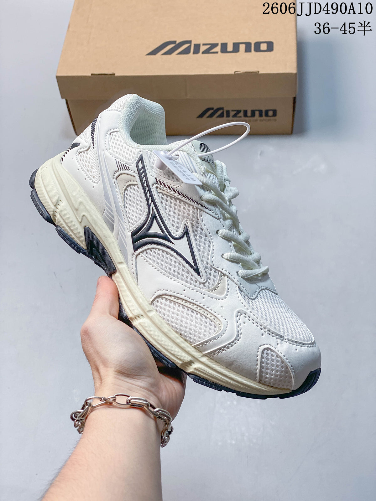 Several Mizuno mesh sneakers arranged in a circle, shown in different color combinations.