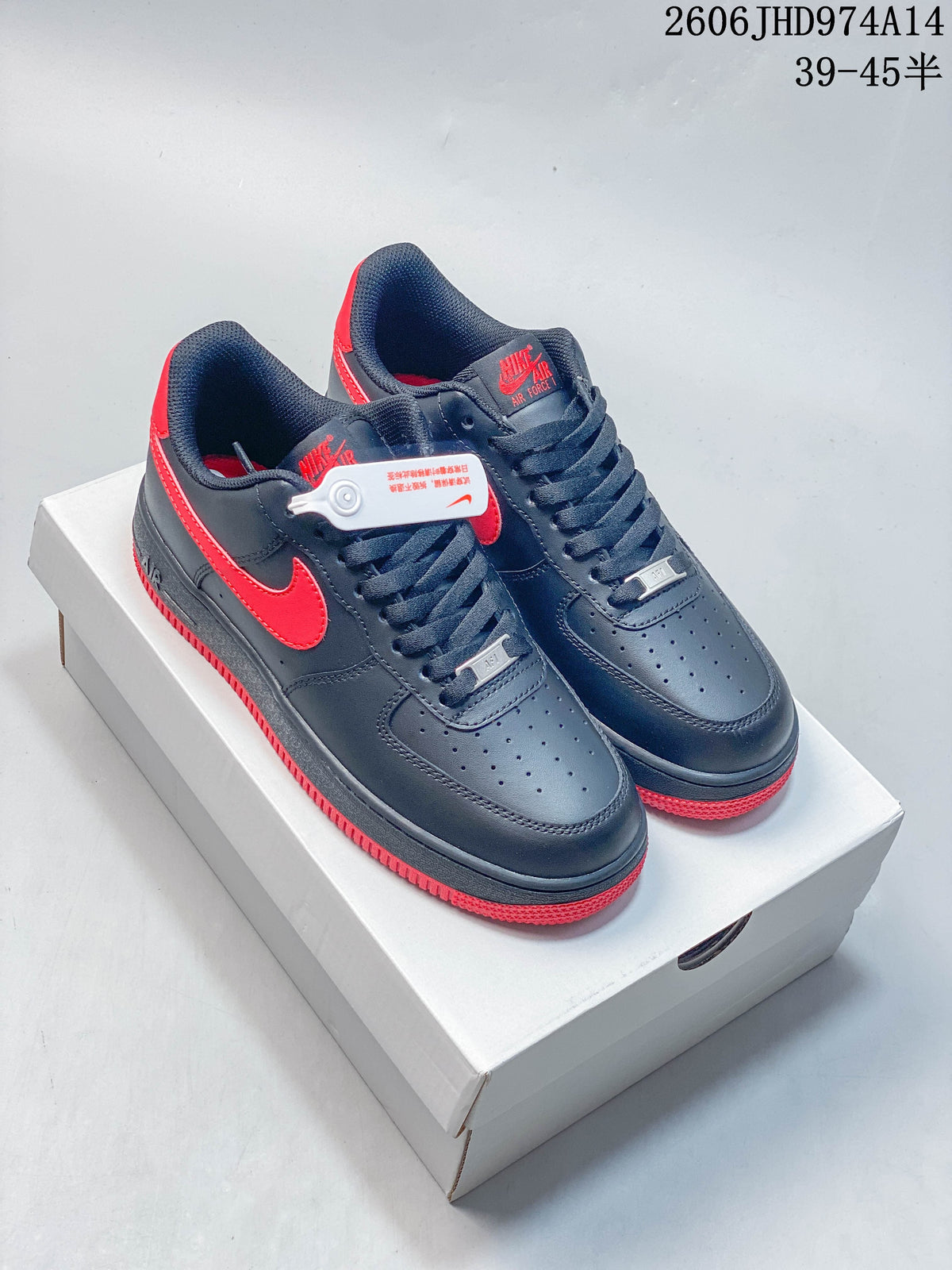 Pair of dark navy low-top Nike Air Force 1 style sneakers with red accents