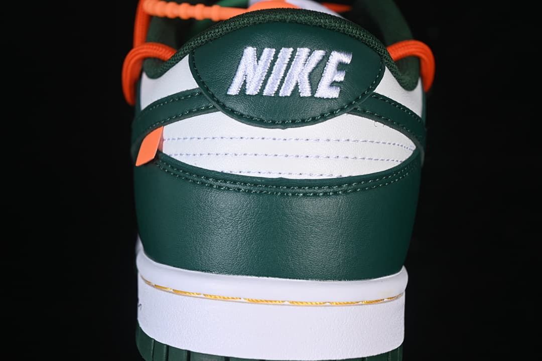 Rear view showing green heel panels and white heel accent