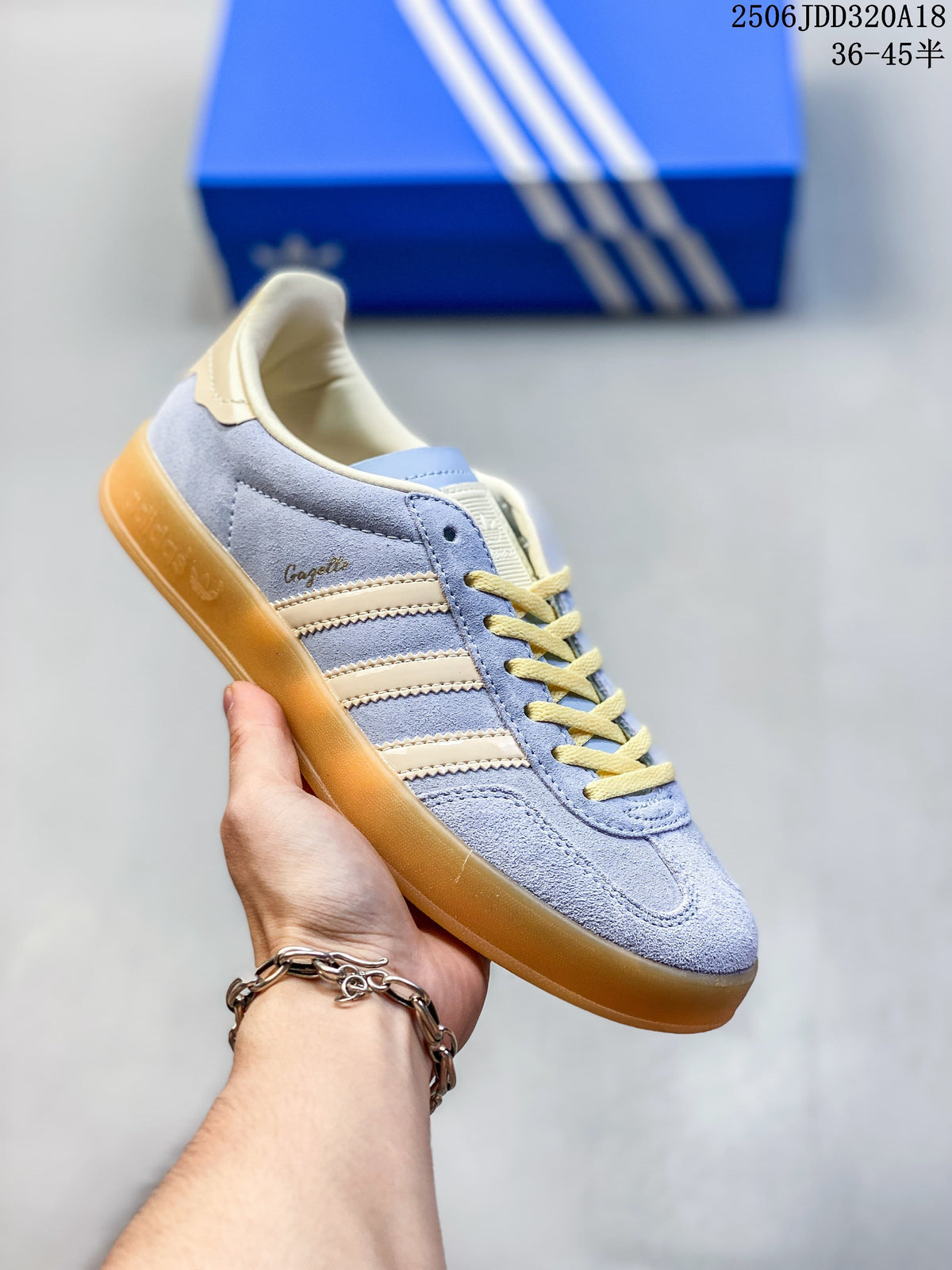 Pale blue Adidas Gazelle low-top sneaker with cream stripes and laces