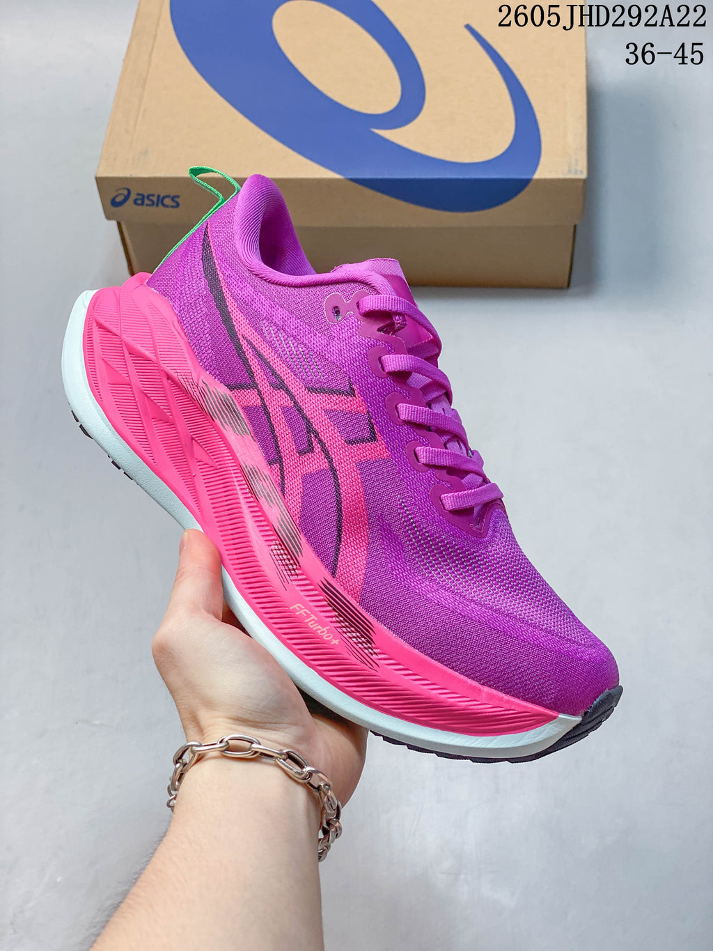 Bright pink and purple ASICS Superblast 2 Paris running shoe.