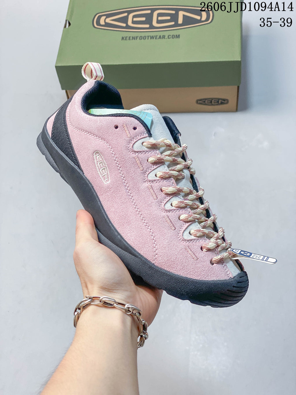 Side view of the pink KEEN Jasper sneaker with patterned laces
