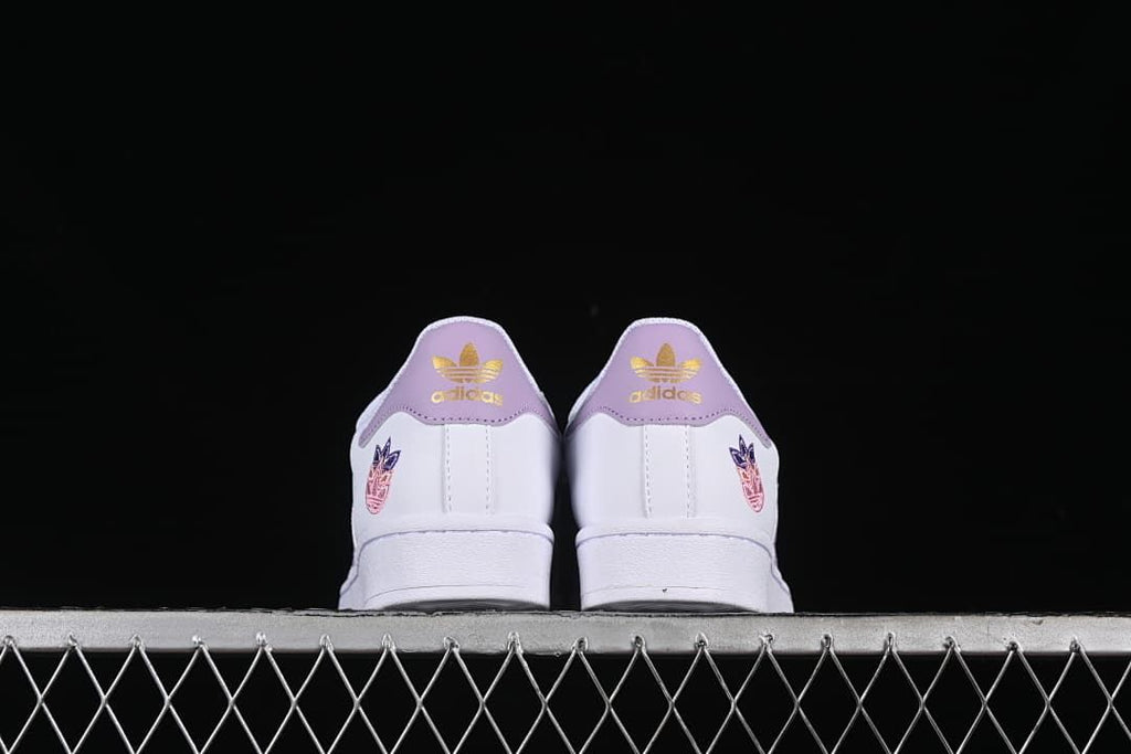 Rear view of both sneakers showing lavender heel panels