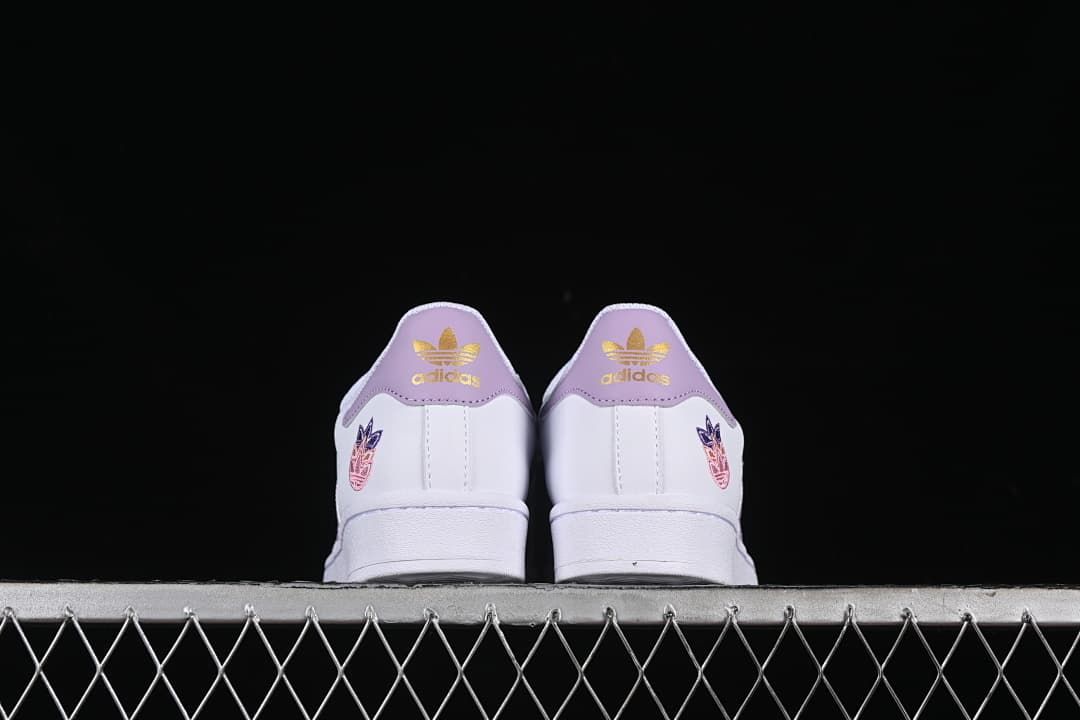 Rear view of both sneakers showing lavender heel panels