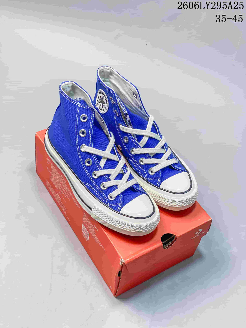 Pair of blue Converse Chuck Taylor All Star high-top sneakers on a box