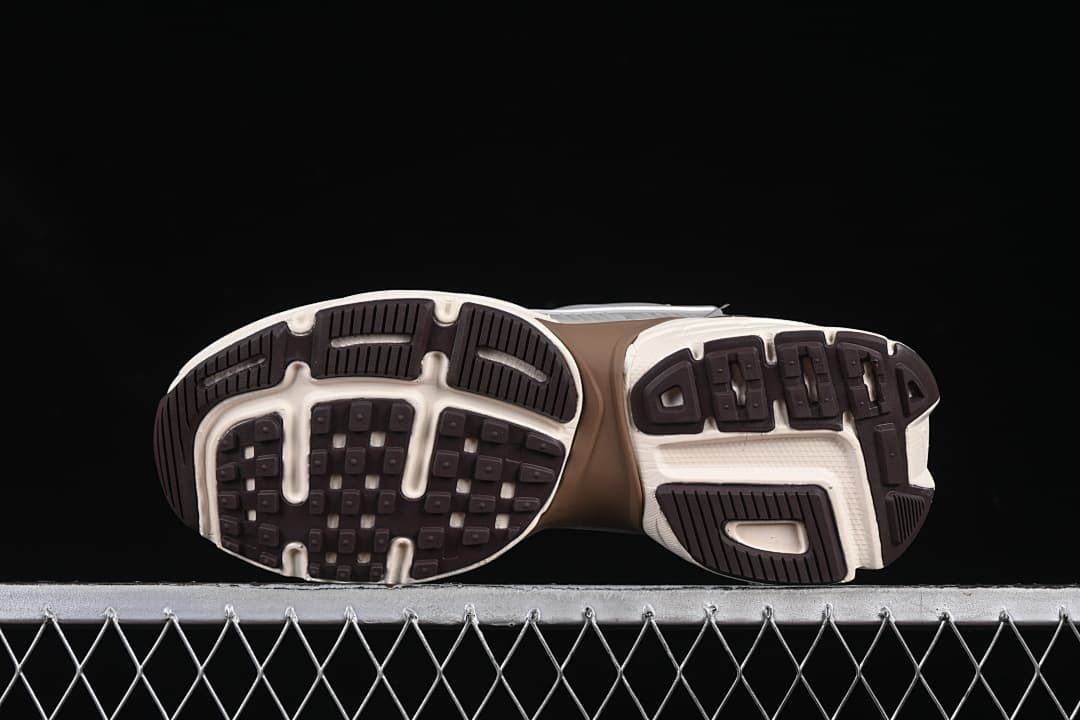 Underside view showing the patterned black and off-white outsoles