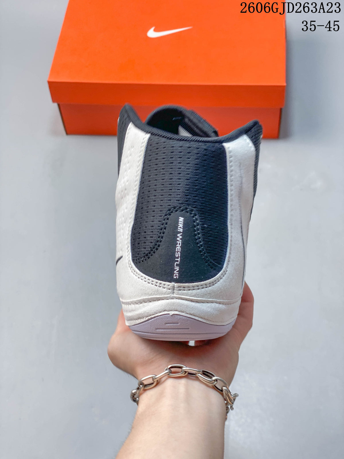 Rear view of the Nike wrestling shoe with padded heel and collar
