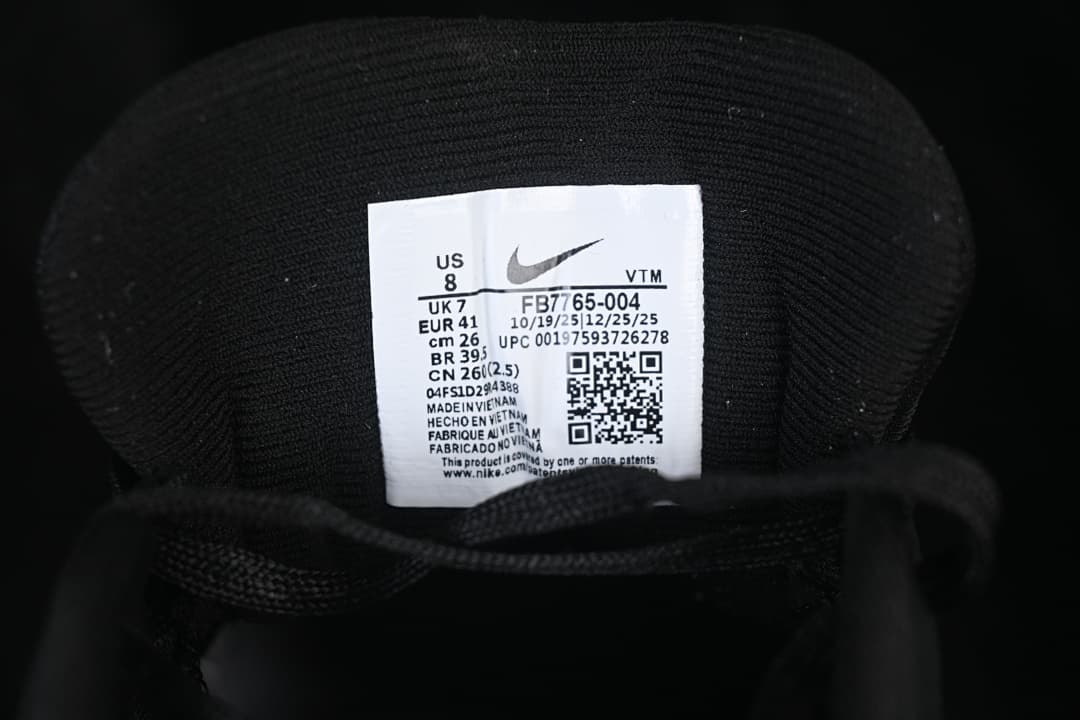 Tongue label showing Nike model code FB7765-004 and sample size markings