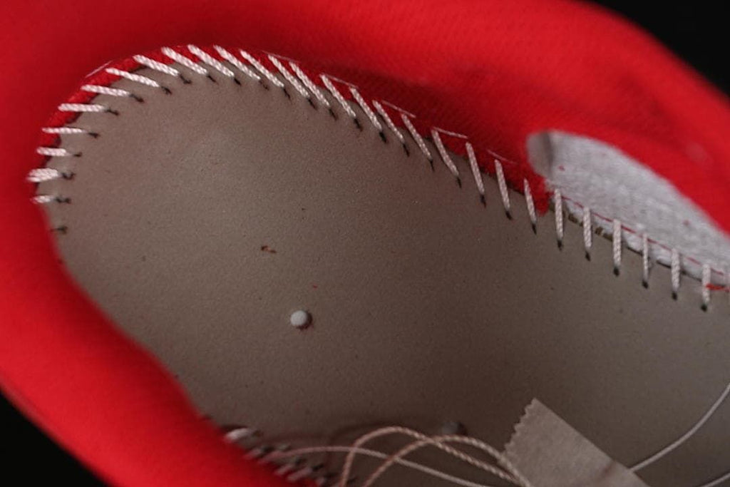Close-up of stitching inside the red-lined shoe collar