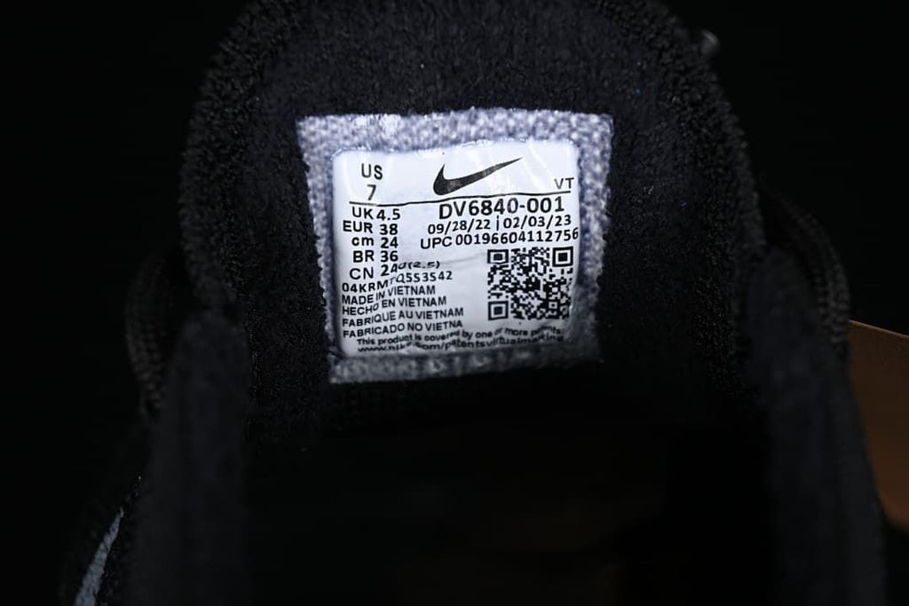 Close-up of the shoe size and style label showing EU 38 and DV6840-001