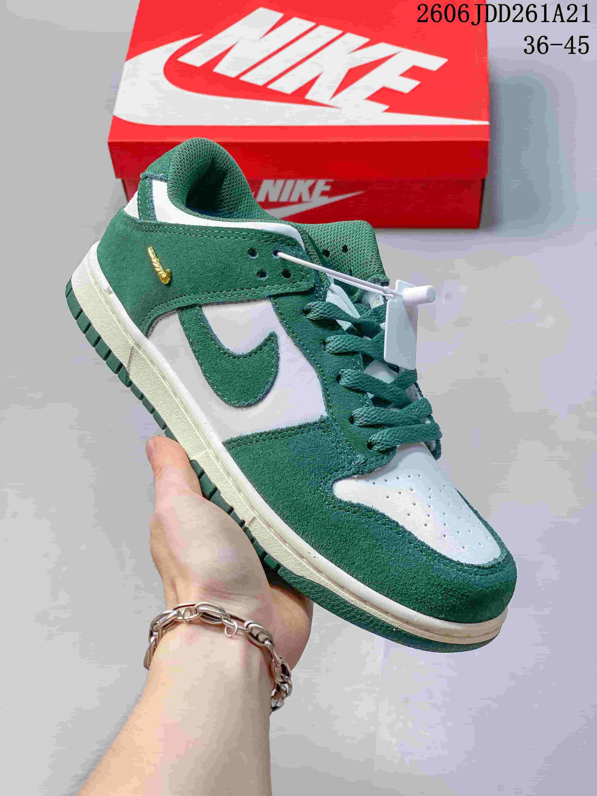 Angled view highlighting the green upper and white panels of a Nike Dunk Low sneaker