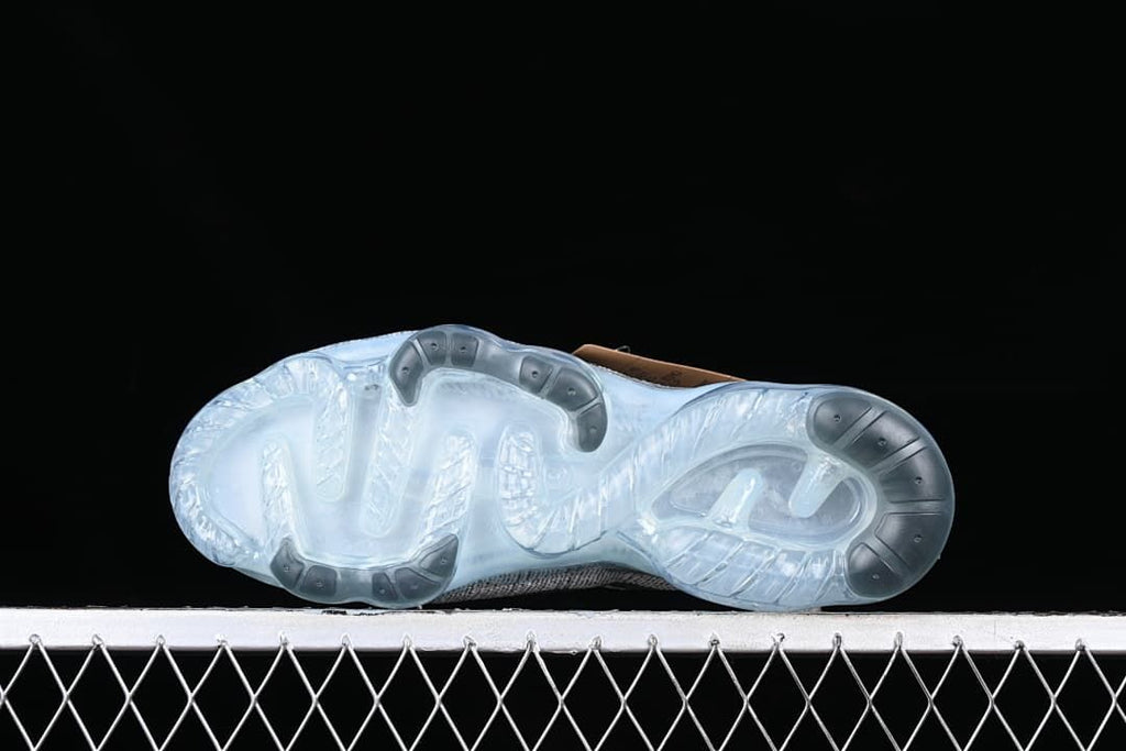 Underside view of the translucent outsole and traction pattern.