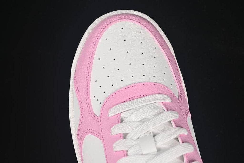 Top-down view of the perforated white toe and pink overlays