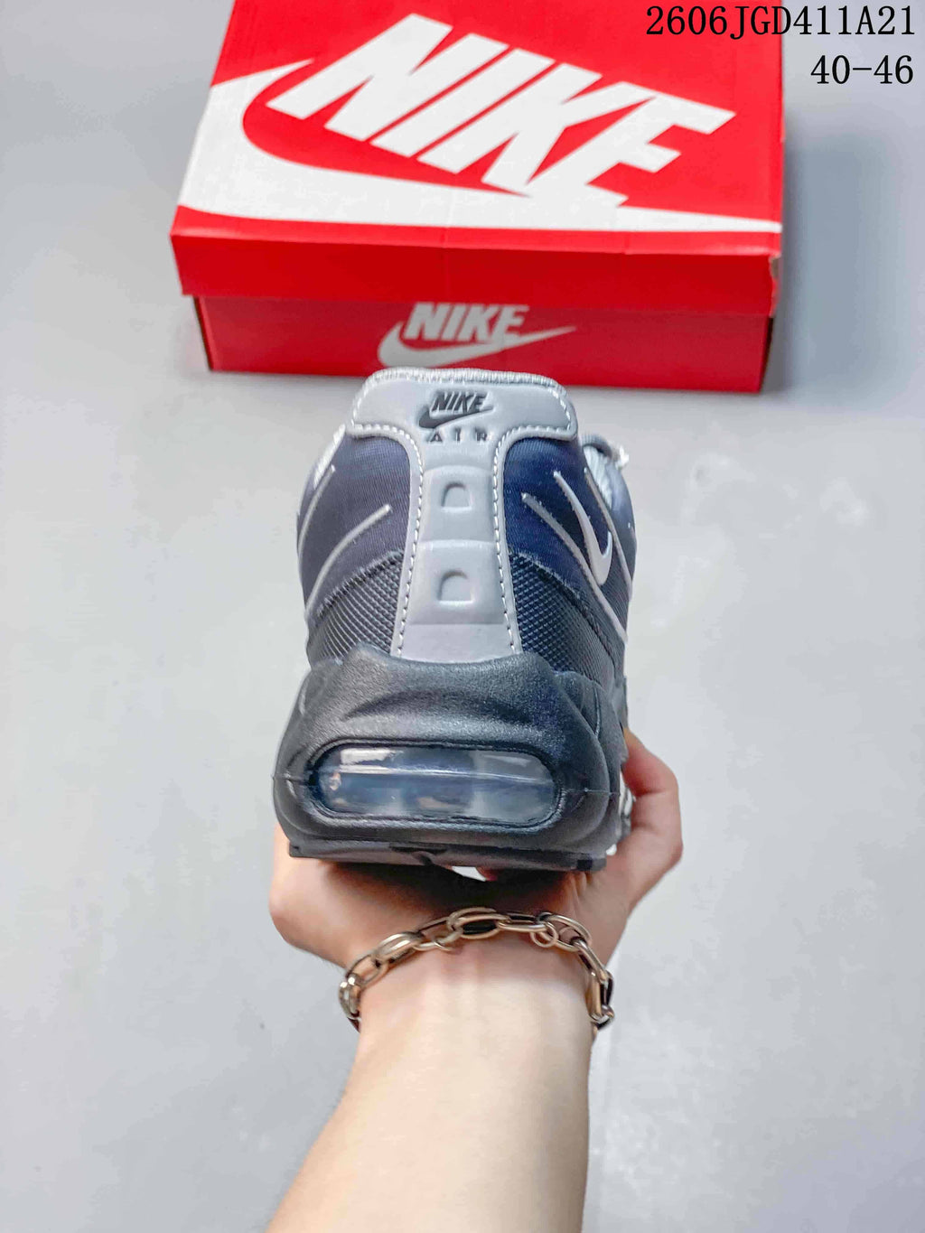 Heel view showing the visible Air unit on a grey Nike Air Max 95