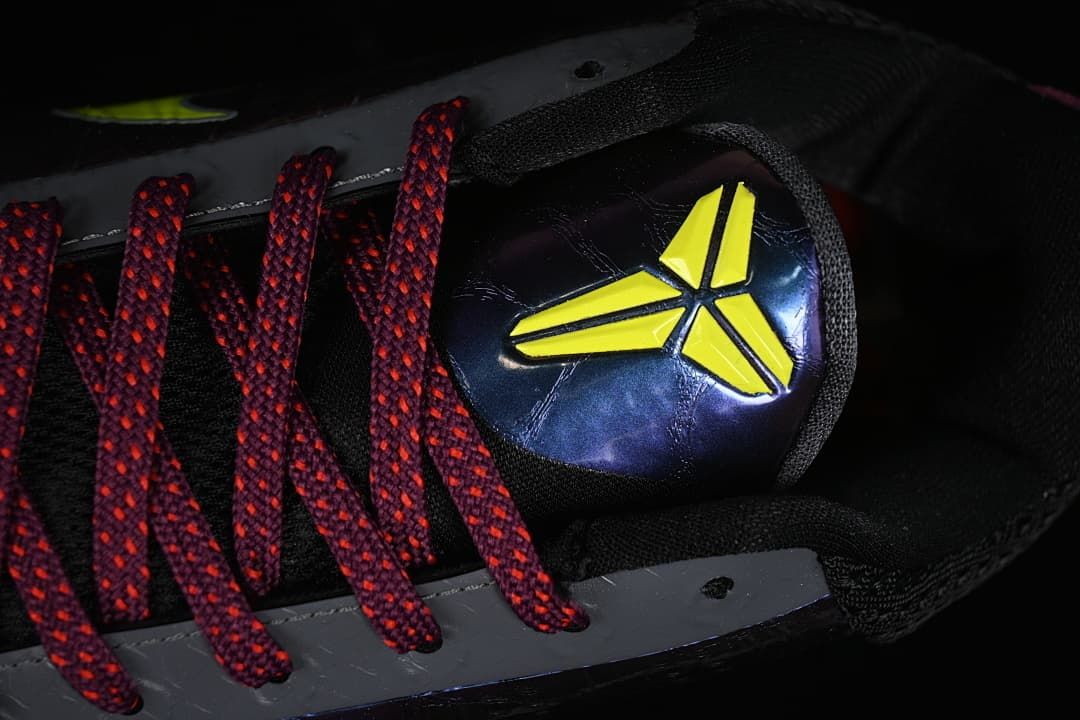Close-up of the tongue emblem and burgundy laces