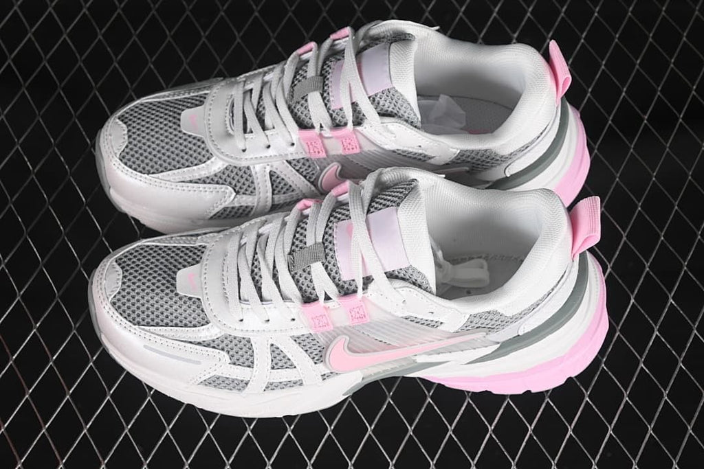 Pair of white, gray, and pink Nike V2K Run sneakers viewed from above