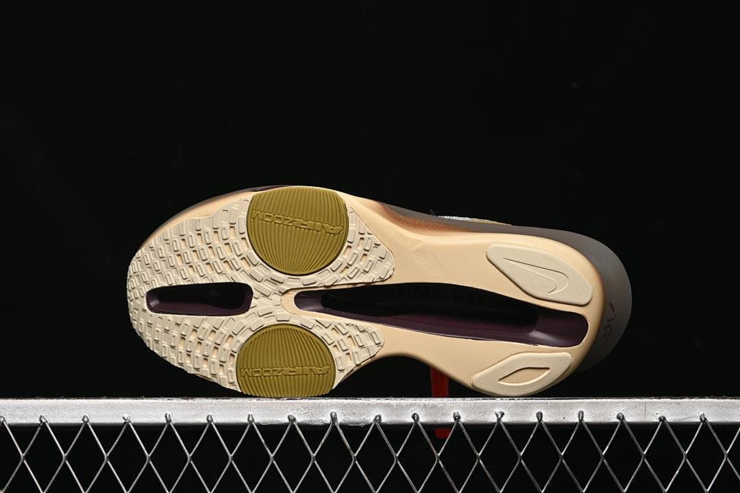 Underside view showing the patterned outsole and exposed midsole sections