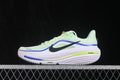 Side profile of pale green Nike Zoom Winflo 12 sneakers with blue trim, black Swoosh and layered midsole.