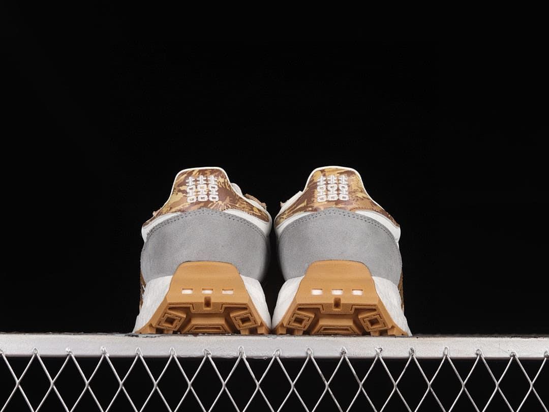 Rear view of both sneakers showing gray heel panels and patterned heel details