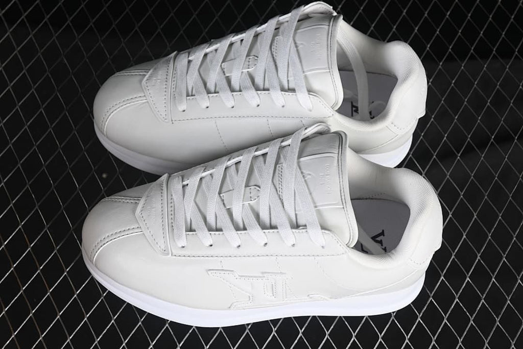 Pair of white low-top sneakers viewed from above