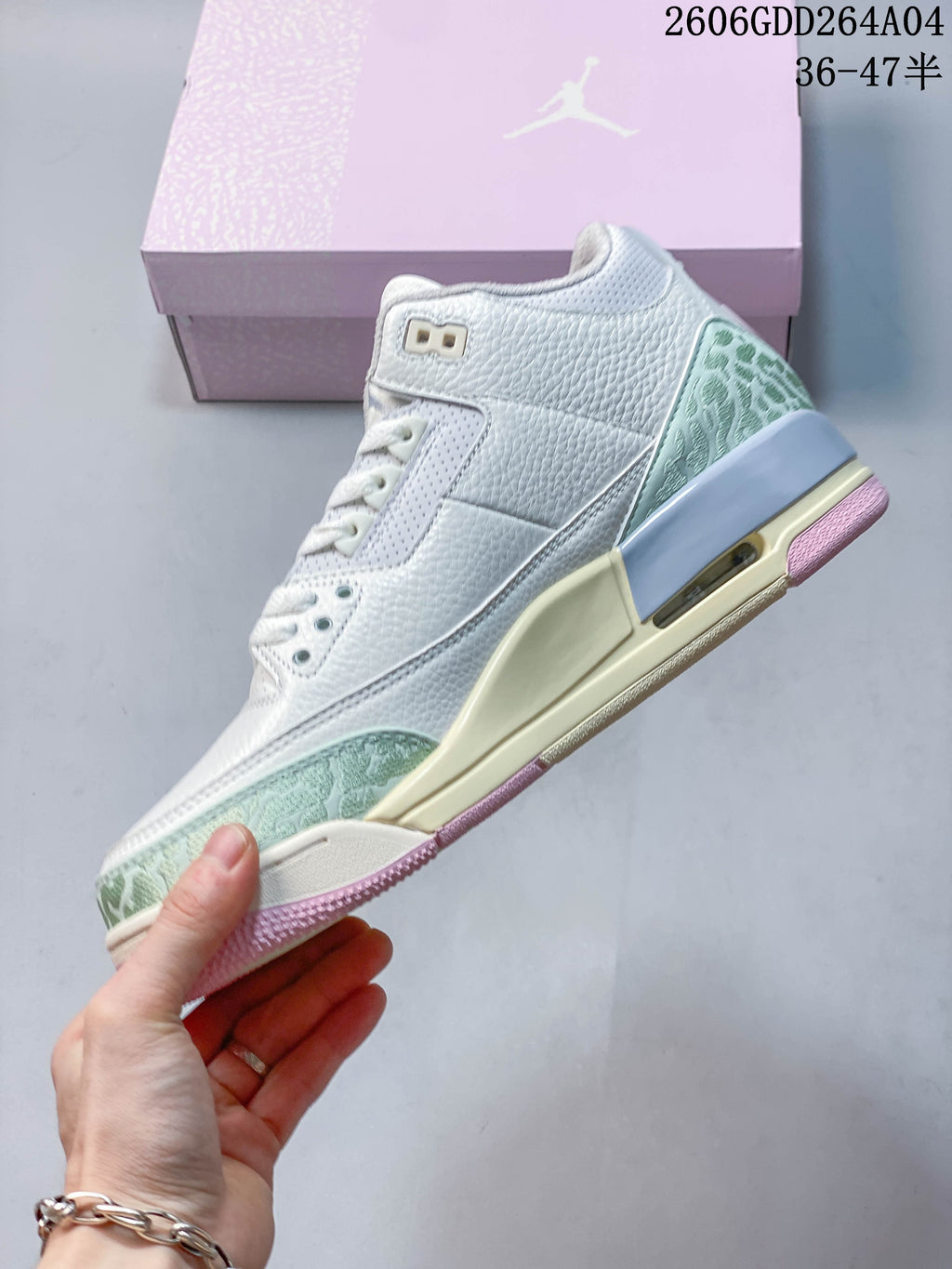 Side profile showing pale green patterned accents and a visible heel Air unit.