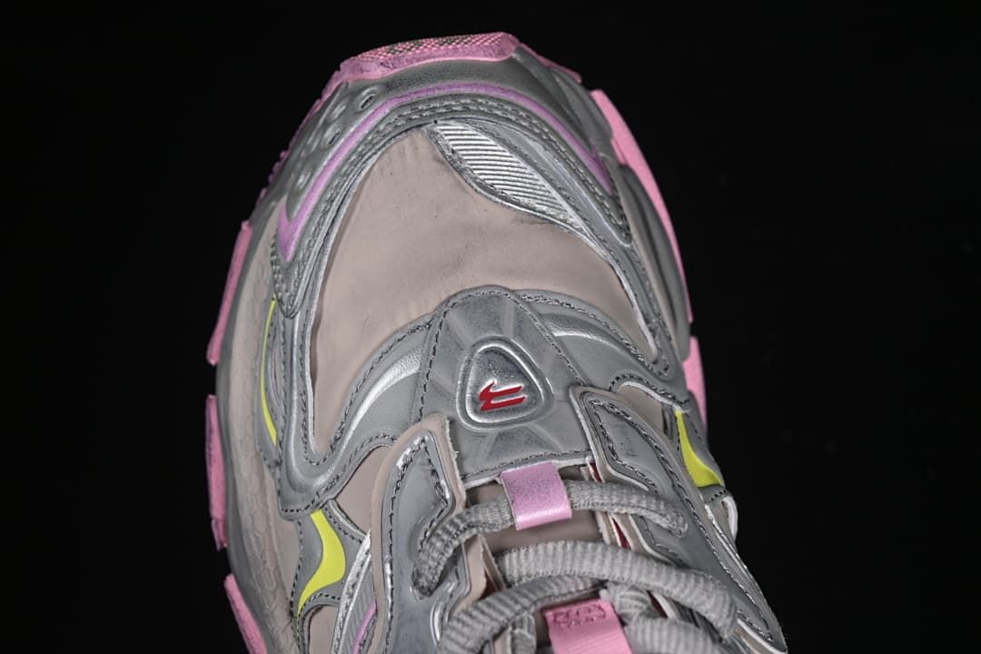 Top-down close-up of the sneaker toe and lace construction.