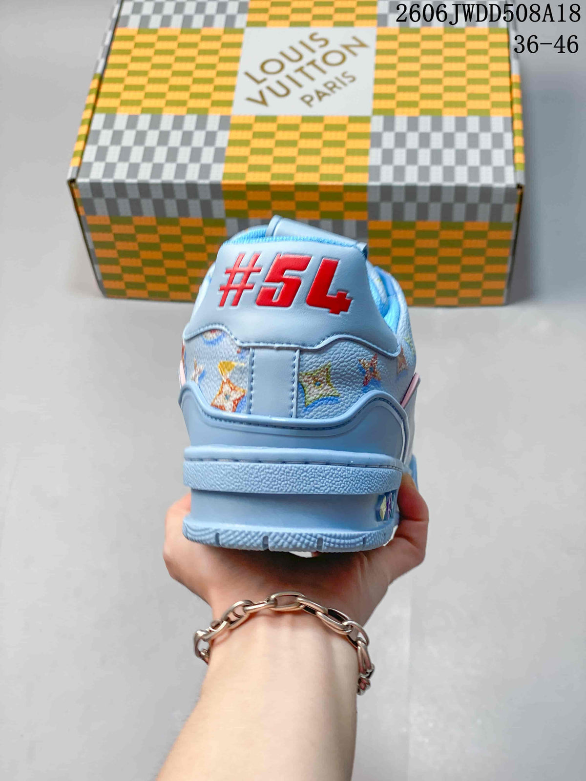 Rear view of the blue sneaker showing a raised heel detail