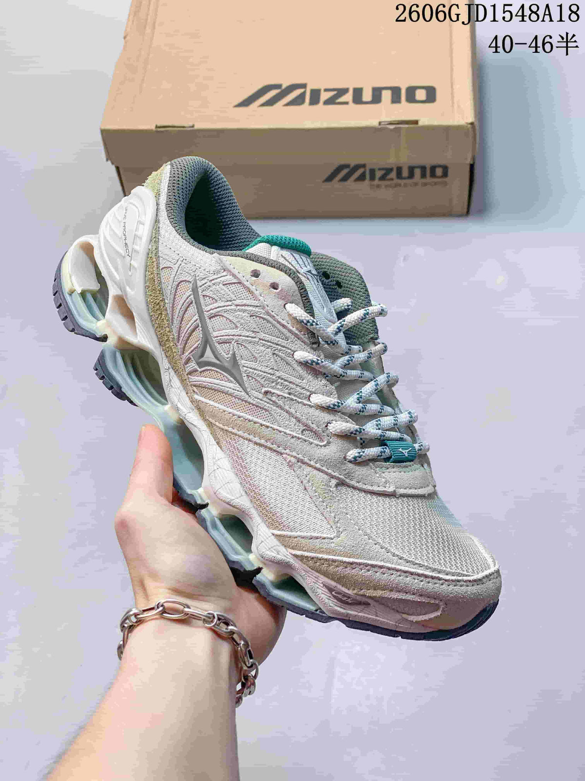 White and pale gray Mizuno Prophecy 8 running shoe with teal accents