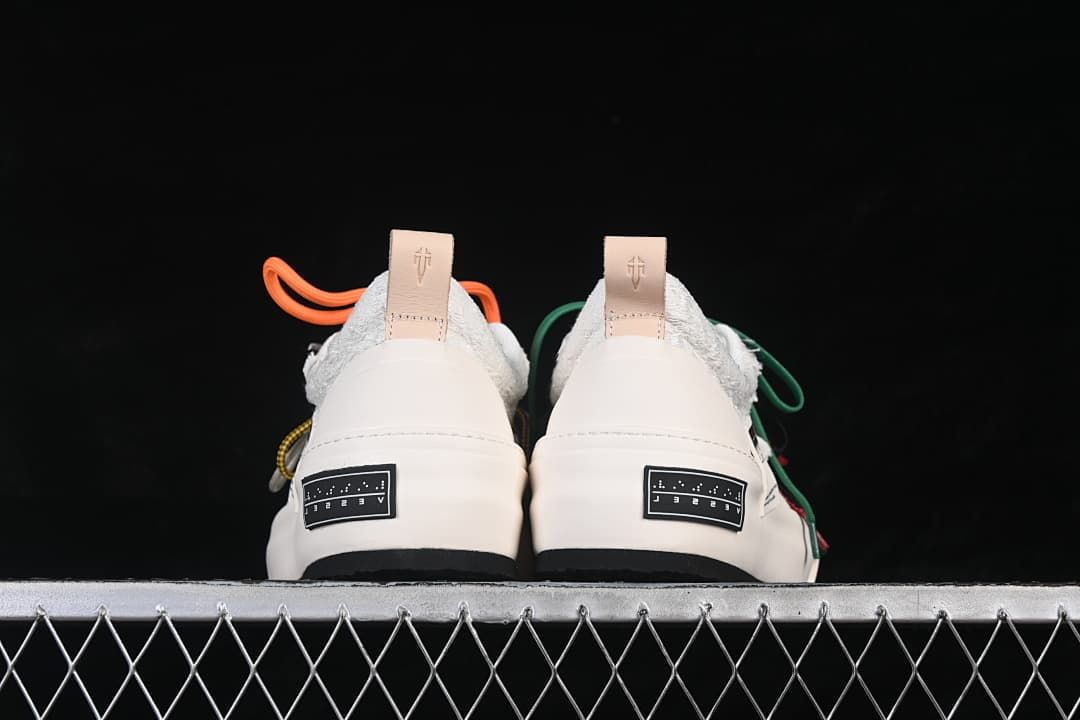 Rear view of both shoes showing heel tabs and labels on the platform soles.