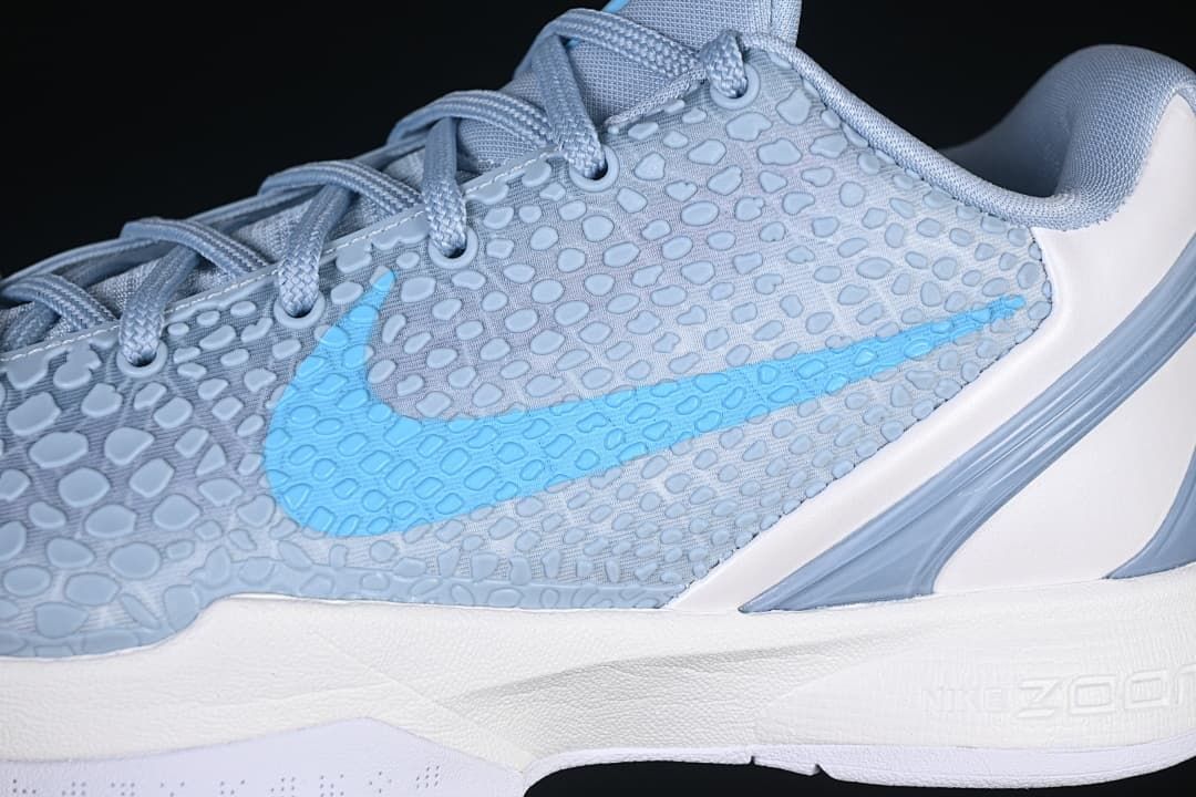 Close-up of the textured upper and blue side Swoosh