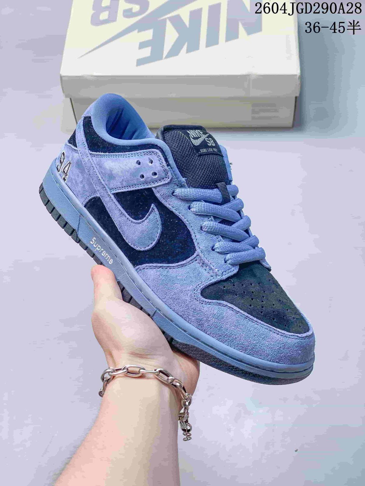 Blue and navy color-block low-top sneaker with textured panels